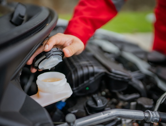 mechanic opening brake fluid cap